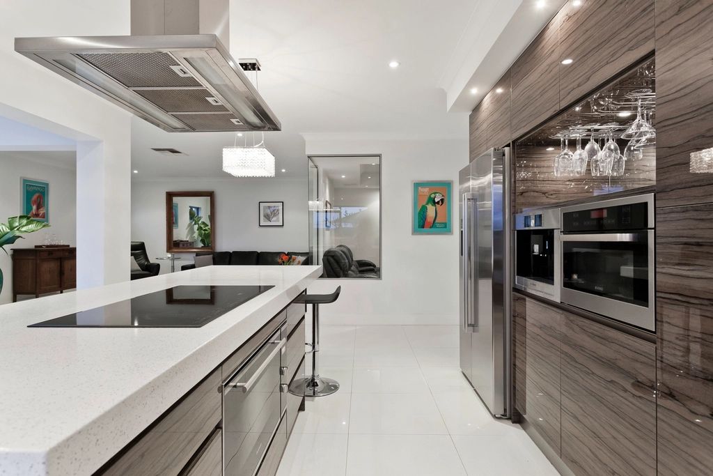 Renovated open kitchen with island and stainless appliances